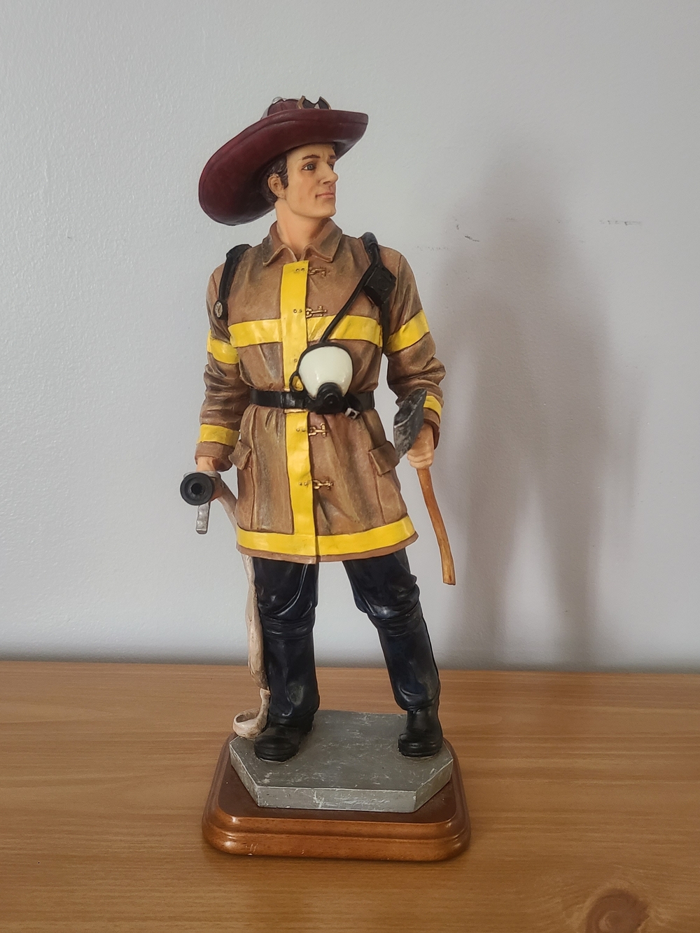 Resin Firefighter Sculpture in Brown and Yellow
